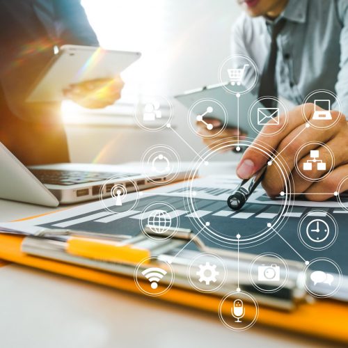 Team business meeting presentation. Hand businessman working   project in modern office.Laptop computer and tablet and smart phone on white desk in morning light