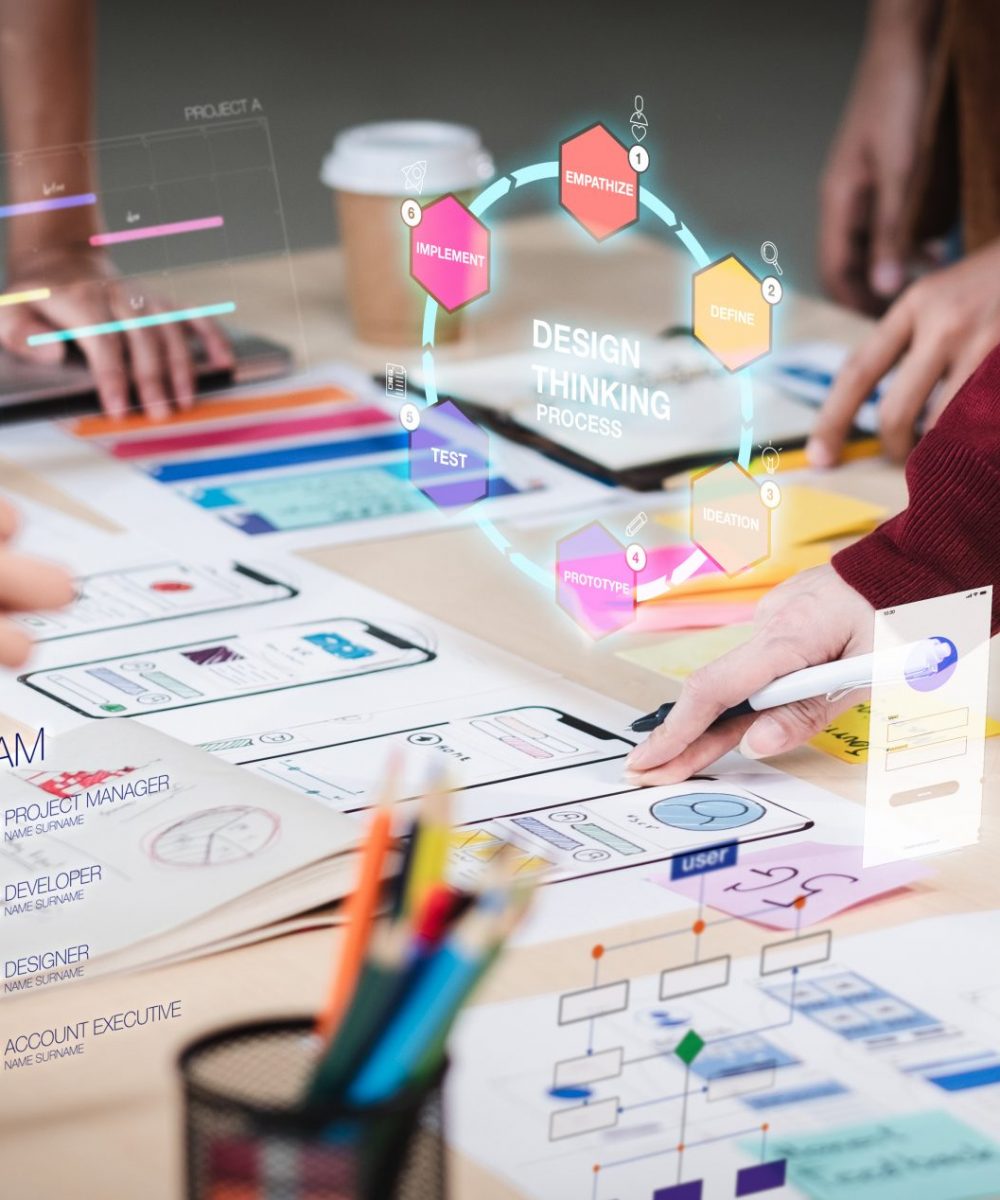 Close up ux developer and ui designer use augmented reality brai Close up ux developer and ui designer use augmented reality brainstorming about mobile app interface wireframe design on desk at modern office.Creative digital development agency