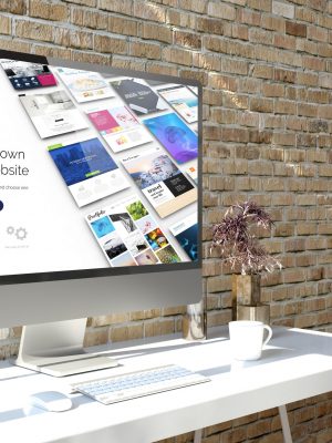 Computer at desktop with website builder on screen 3d rendering