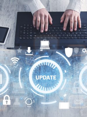 Hands typing in computer keyboard. Installing software update process
