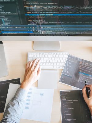 Professional Developer programmer working a software website design and coding technology, writing codes and database in company office, Global cyber connection technology.